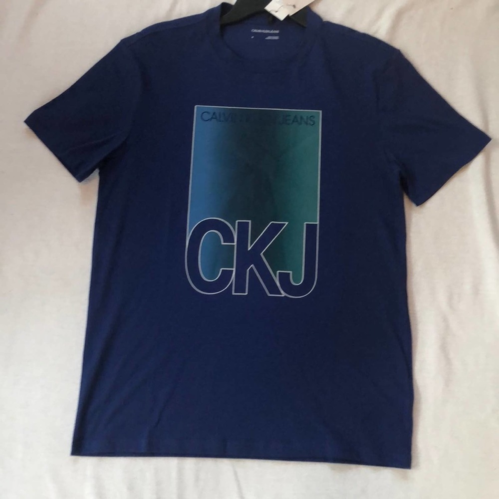 Brand new Blue Calvin Klein Jeans T-Shirt.